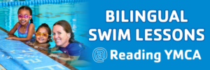 Children learning to swim during bilingual swim lessons at the Reading YMCA indoor pool in Reading, PA.