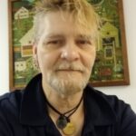 Roy, a YMCA Men’s Bridge program graduate, smiling at the YMCA of Reading and Berks County after rebuilding his life through recovery and community support.