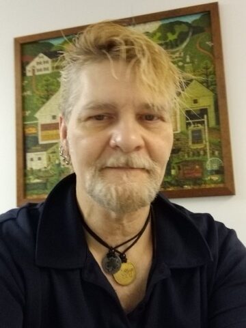 Roy, a YMCA Men’s Bridge program graduate, smiling at the YMCA of Reading and Berks County after rebuilding his life through recovery and community support.