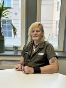 Roy, a YMCA Men’s Bridge program graduate, smiling at the YMCA of Reading and Berks County after rebuilding his life through recovery and community support.