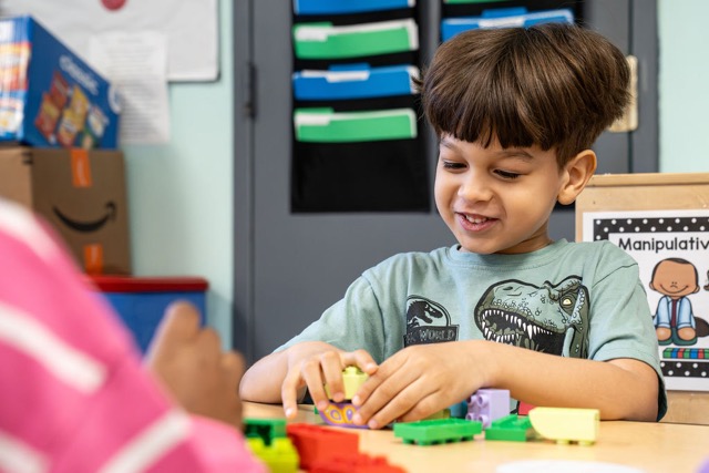 Child in Pre-K Counts program at YMCA Early Learning Center learning through hands-on classroom activities