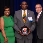 Breakfast of Champions honoree, Wynton Butler recognized with Ken Borkey, President and CEO of the YMCA of Reading & Berks County, and Crystal Gilmore-Harris, YMCA board member.