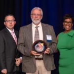 Breakfast of Champions honoree Doug Dahms photographed with Ken Borkey, President and CEO of the YMCA of Reading & Berks County, and Crystal Gilmore-Harris, YMCA board member.