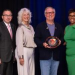 Breakfast of Champions honoree Schlouch, Inc.'s Barru Schlouch and wife Deb Schlouch, standing with Ken Borkey, President and CEO of the YMCA of Reading & Berks County, and Crystal Gilmore-Harris, YMCA board member.