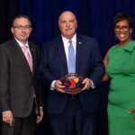 Breakfast of Champions honoree Midd Penn Bank's Joe Butto recognized alongside Ken Borkey, President and CEO of the YMCA of Reading & Berks County, and Crystal Gilmore-Harris, YMCA board member.