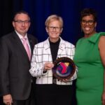 Breakfast of Champions honoree, Susan Looney, posing with Ken Borkey, President and CEO of the YMCA of Reading & Berks County, and Crystal Gilmore-Harris, YMCA board member.